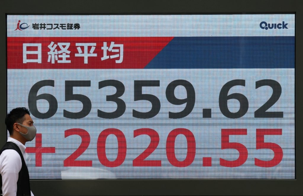 Japan’s Nikkei stock index tops 65,000 for 1st time